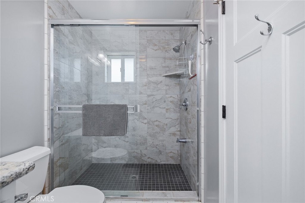 39317 Point Bass Lake, CA 93604 - Photo 30 of 67 a bathroom with a shower and a toilet