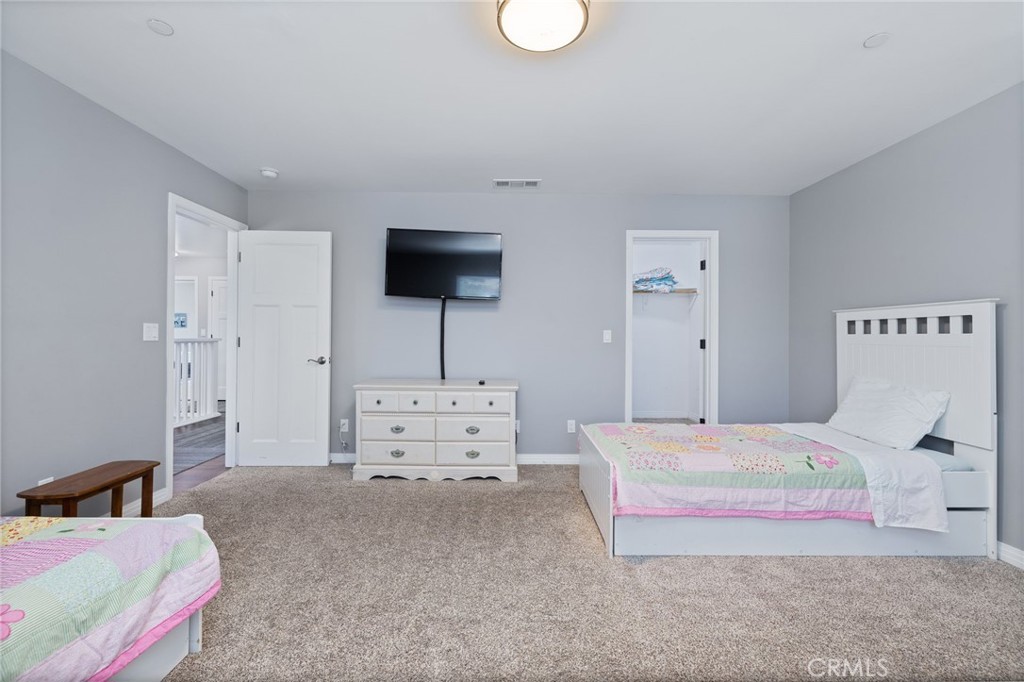 39317 Point Bass Lake, CA 93604 - Photo 34 of 67 a bedroom with a bed and flat screen tv