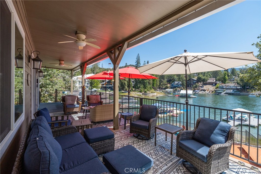 39317 Point Bass Lake, CA 93604 - Photo 49 of 67 a view of a patio with couches potted plants and a table