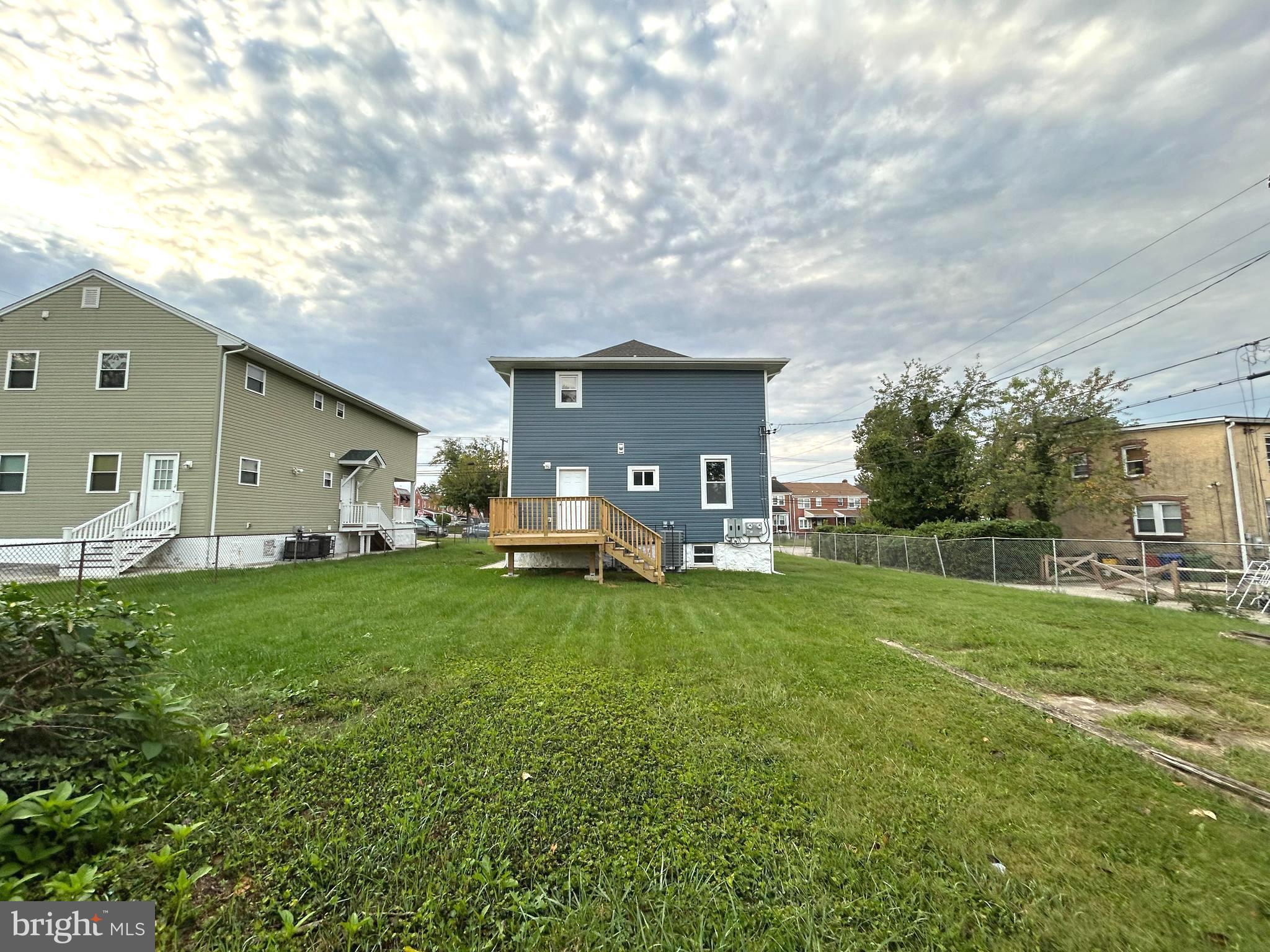 3902 West Rogers Avenue, Unit 1 Baltimore, MD 21215 - Photo 11 of 12 a view of a house with backyard and a tree