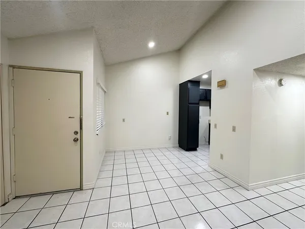 a kitchen with sink a microwave a stove and cabinets