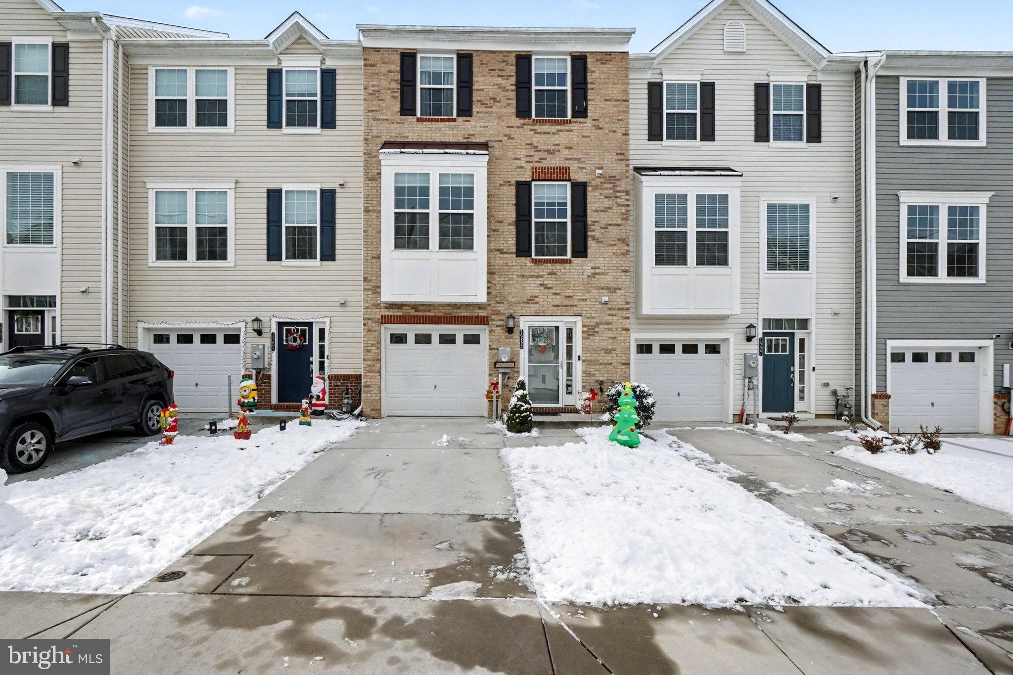 a view of a street that has couple of cars parked in front of it