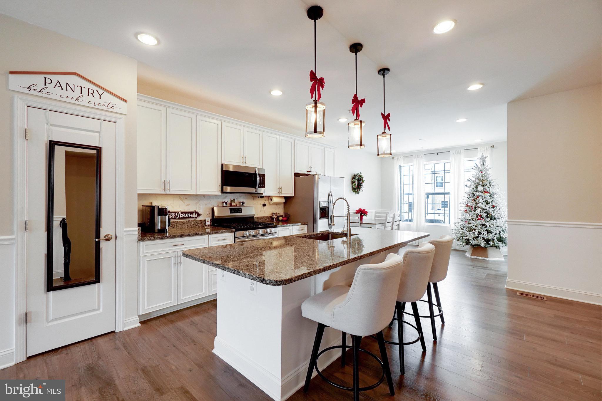 1225 Fenwick Road Aberdeen, MD 21001 - Photo 13 of 52 a kitchen with granite countertop a center island a sink stainless steel appliances and cabinets