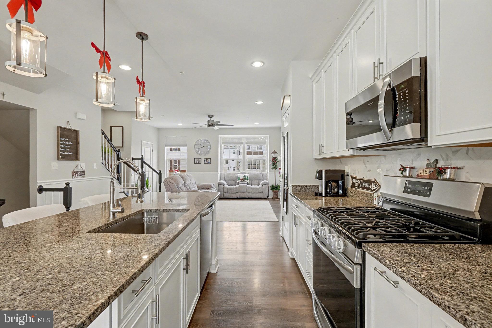 1225 Fenwick Road Aberdeen, MD 21001 - Photo 17 of 52 a kitchen with stainless steel appliances granite countertop a sink stove and refrigerator