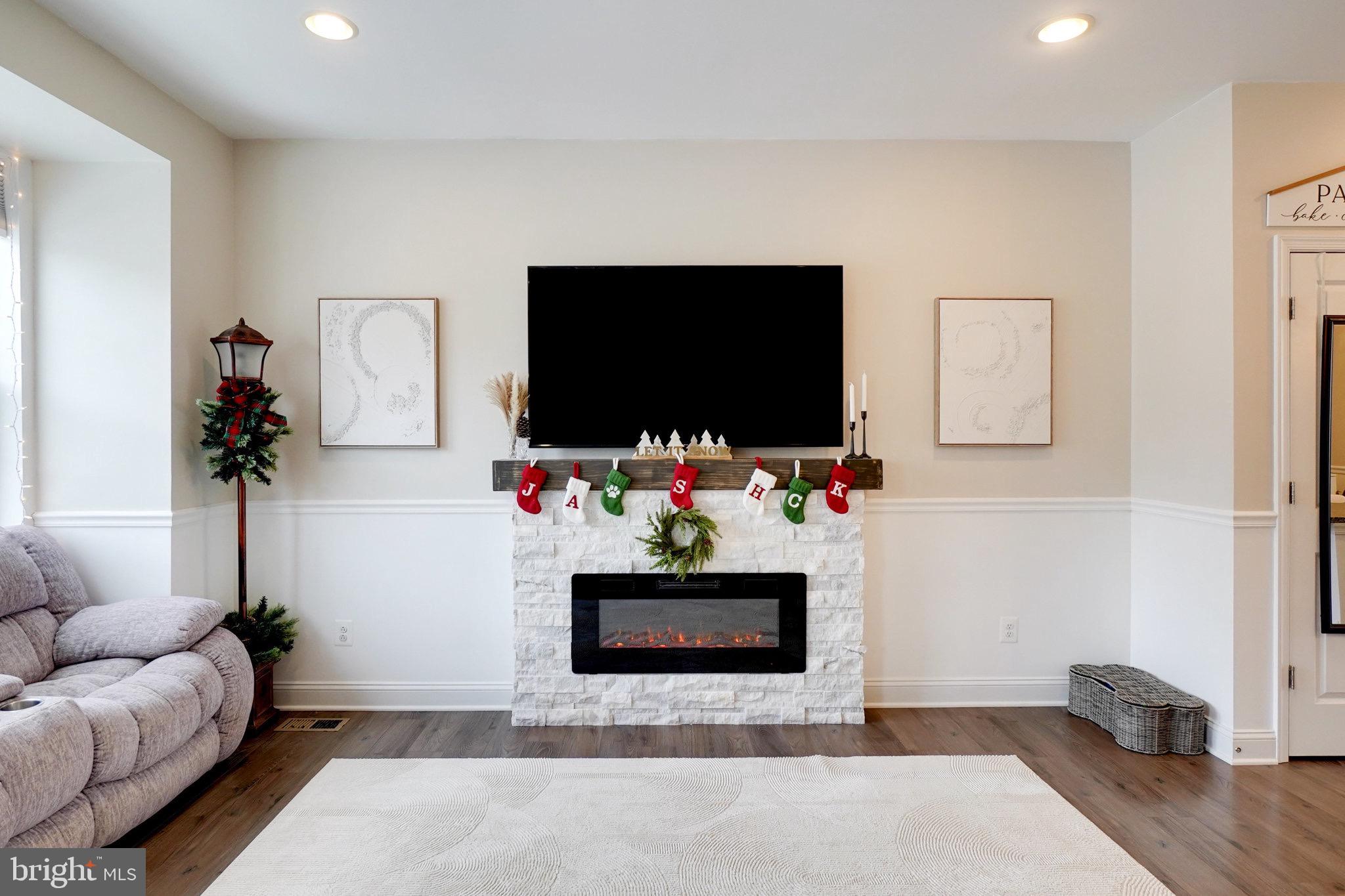 1225 Fenwick Road Aberdeen, MD 21001 - Photo 27 of 52 a living room with furniture and a flat screen tv