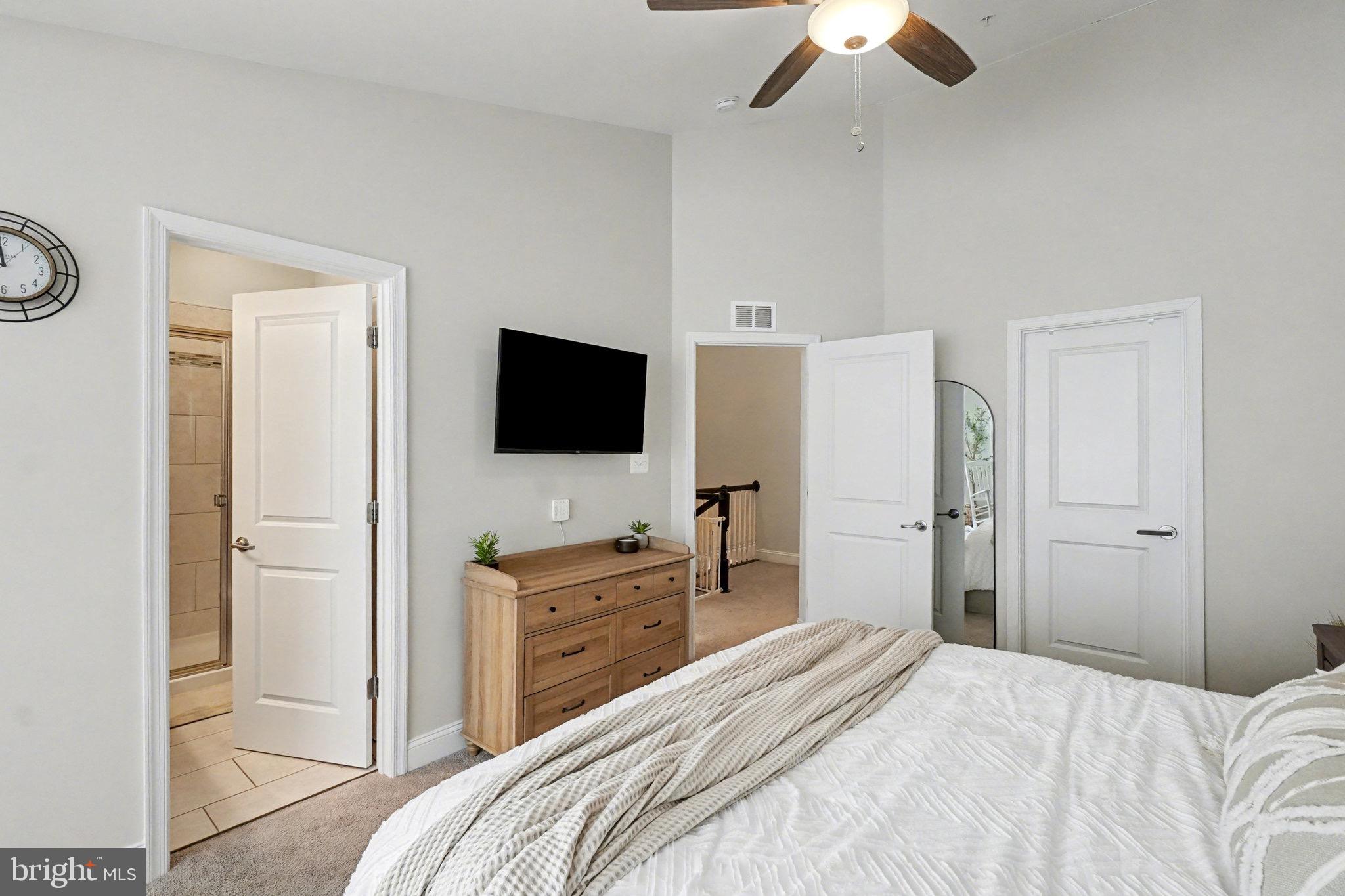 1225 Fenwick Road Aberdeen, MD 21001 - Photo 35 of 52 a bedroom with a bed and a flat tv screen on dresser