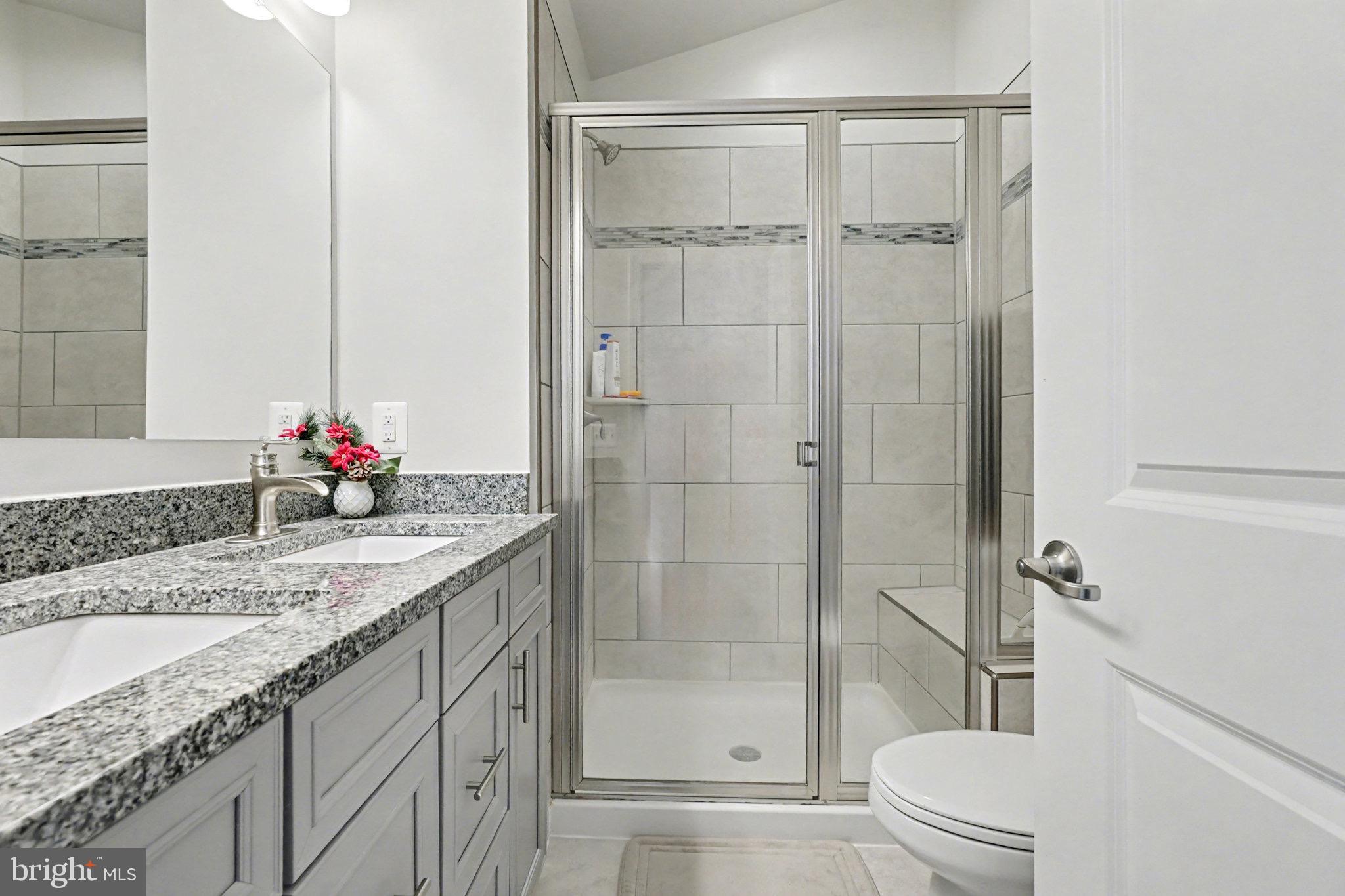 1225 Fenwick Road Aberdeen, MD 21001 - Photo 36 of 52 a bathroom with a granite countertop sink vanity mirror and toilet