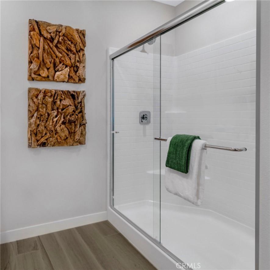 2074 Wild Wds Upland, CA 91786 - Photo 8 of 17 a bathroom with a bathtub and shower