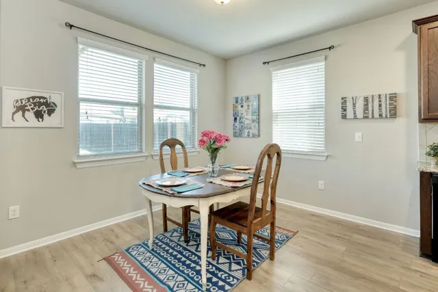 a kitchen with a refrigerator a sink a stove a microwave and cabinets