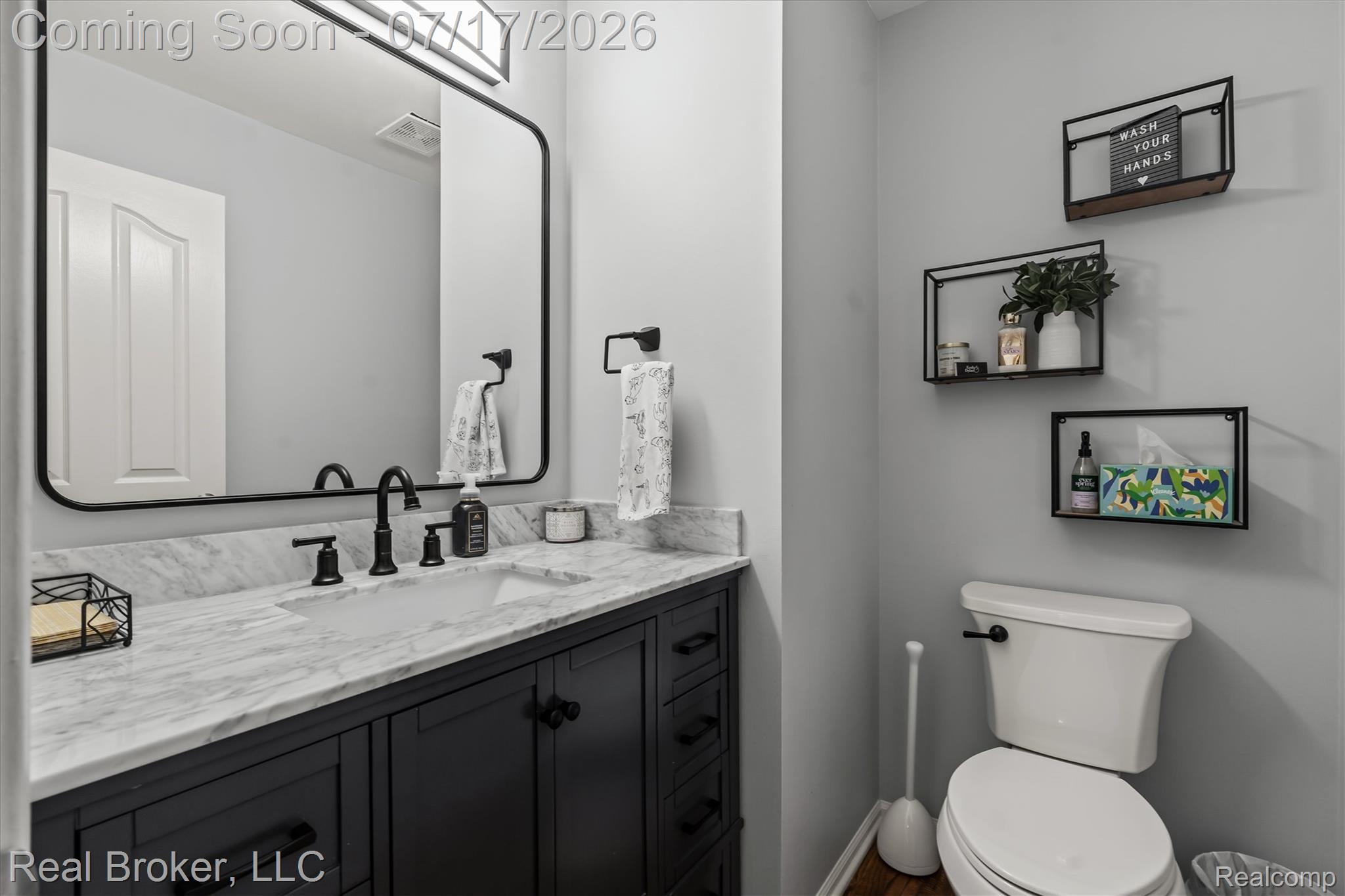 45192 Thornhill Road Canton, MI 48188 - Photo 10 of 34 Bathroom featuring a vanity with a white stone countertop, undermount sink, and matte black fixtures