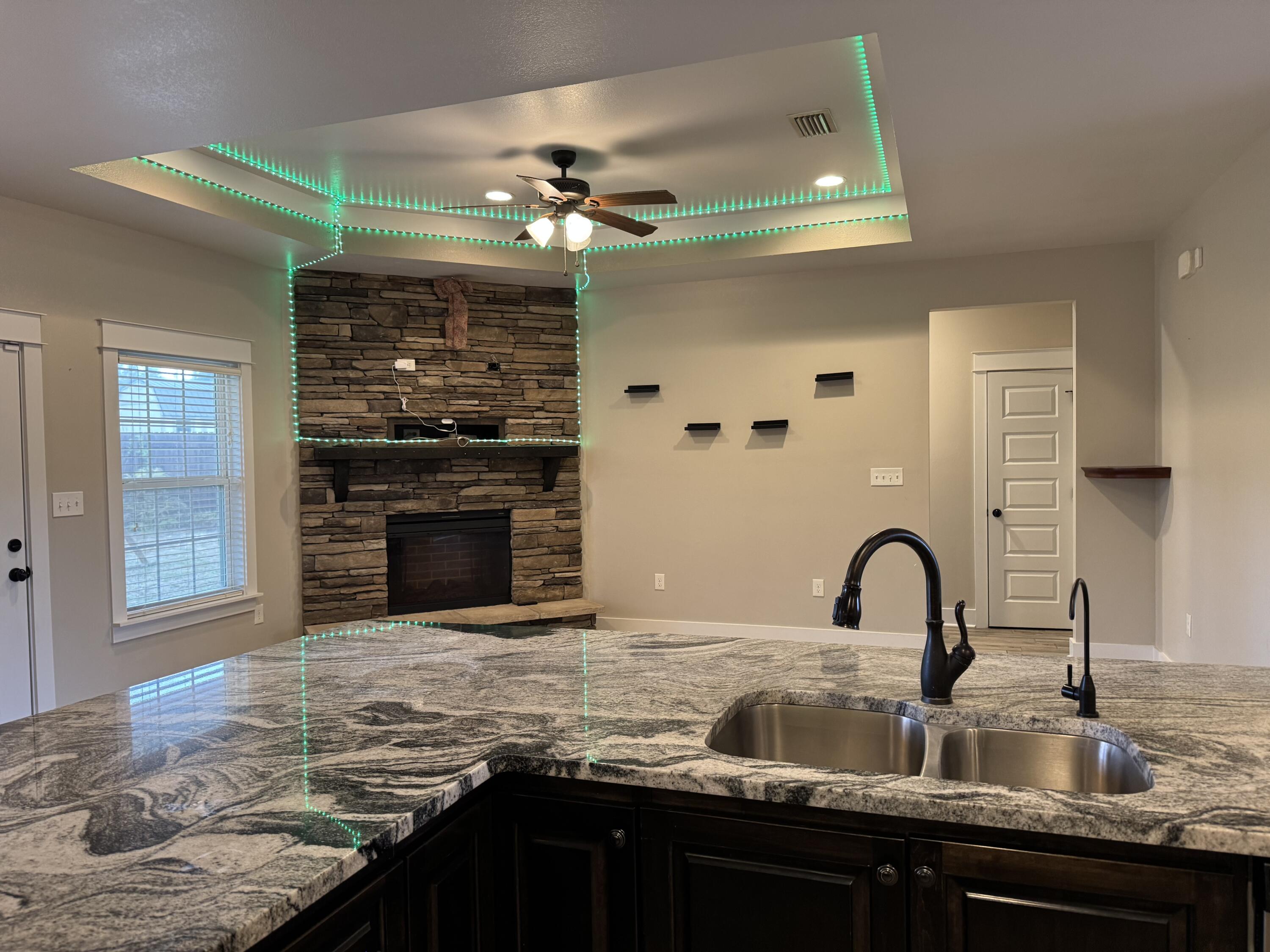4075 Happy Trails Road Crestview, FL 32539 - Photo 5 of 11 a kitchen with kitchen island granite countertop a stove and a sink with granite countertops