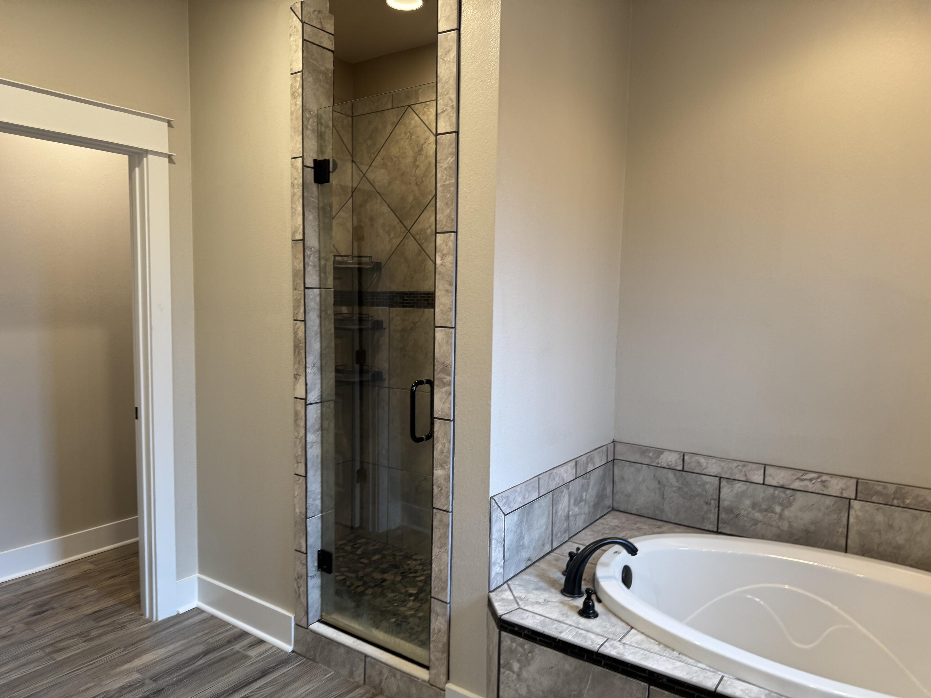 4075 Happy Trails Road Crestview, FL 32539 - Photo 8 of 11 a bathroom with a bathtub and a shower