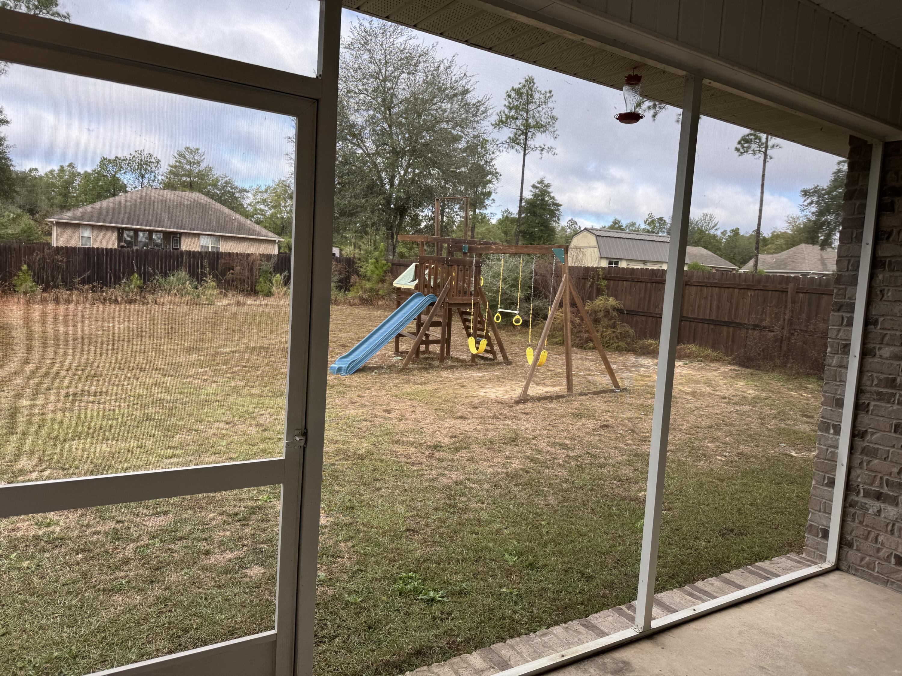 4075 Happy Trails Road Crestview, FL 32539 - Photo 10 of 11 a view of a glass door with a balcony