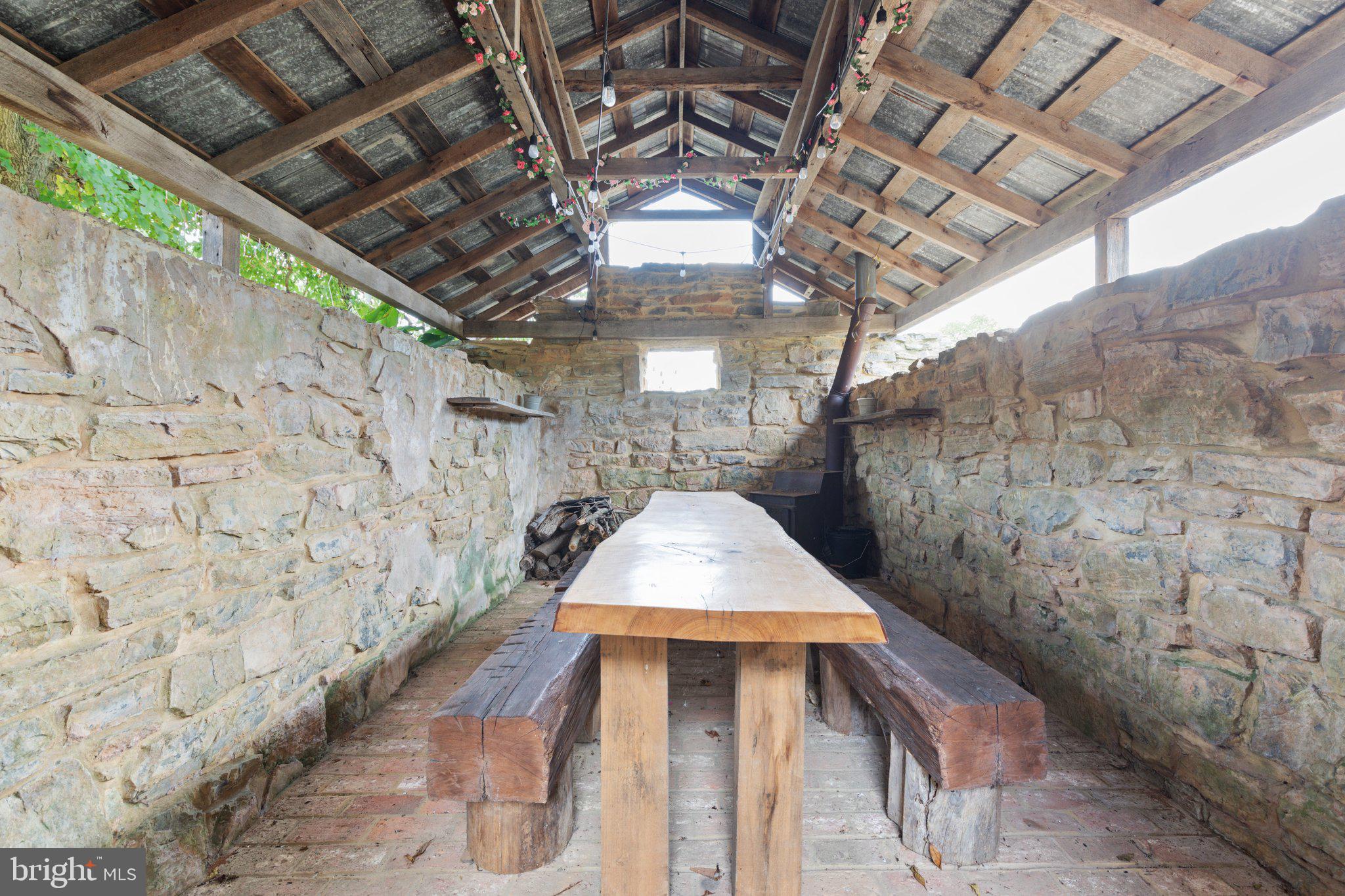 7252 Middle Road Middletown, VA 22645 - Photo 32 of 49 Ice house/root cellar w/live edge table from land