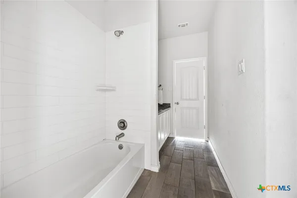 a view of a bathtub in a bathroom