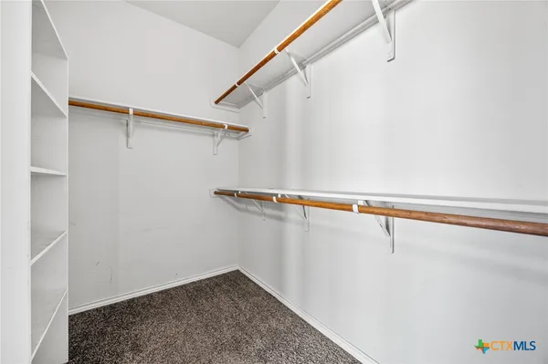 a view of a room with racks on the wall