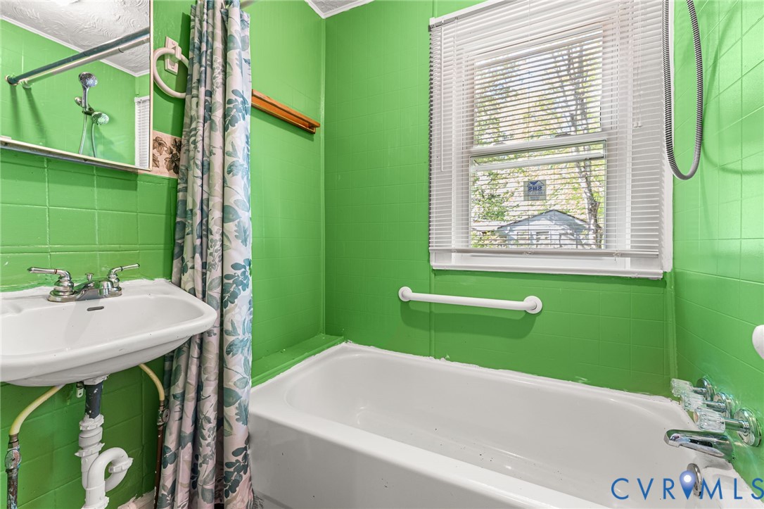 2097 Coles Point Road Hague, VA 22469 - Photo 21 of 34 a bathroom with a sink and a mirror