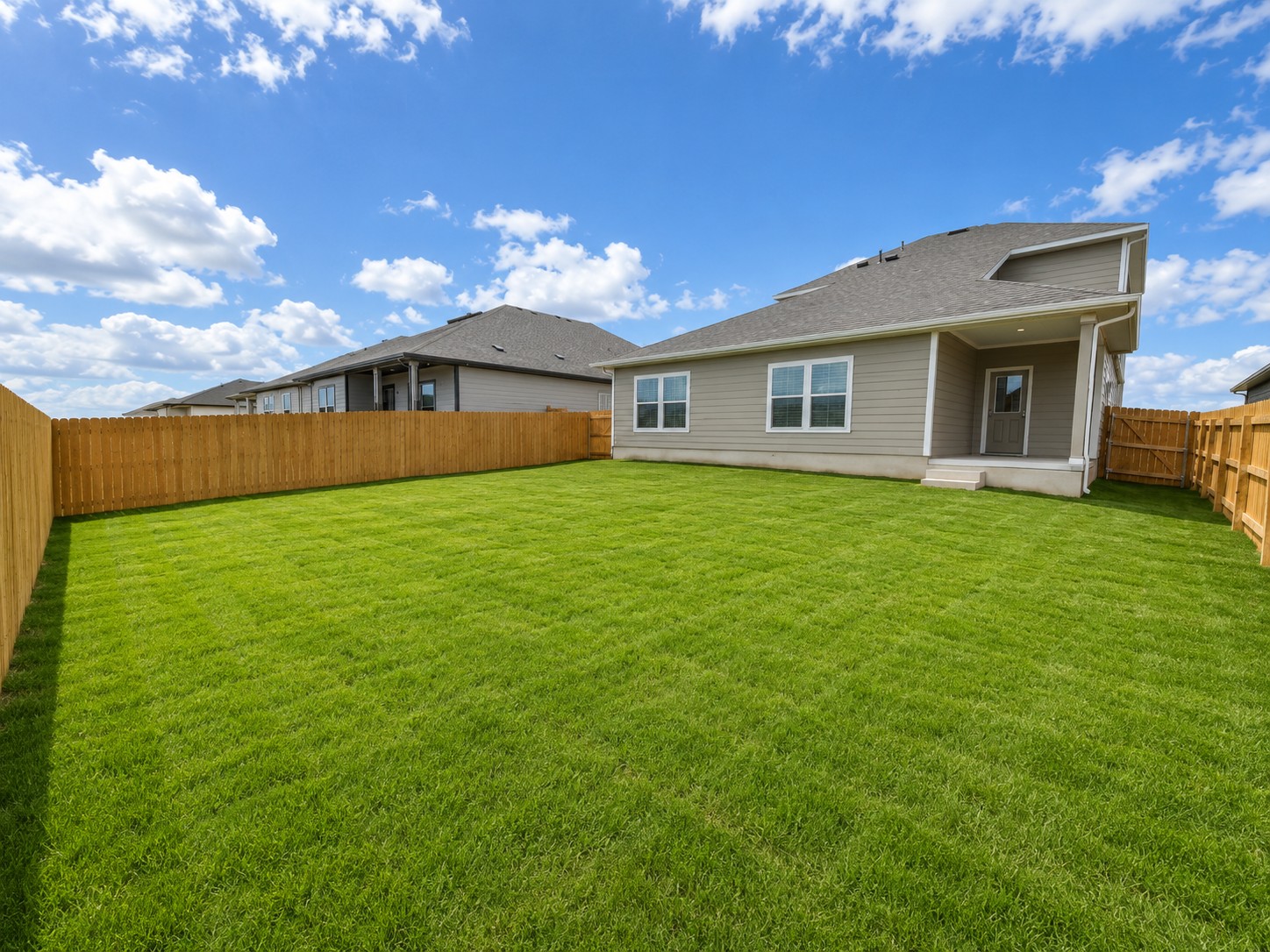 156 Wind Hill Jarrell, TX 76537 - Photo 18 of 22 a view of a house with a yard and a garage