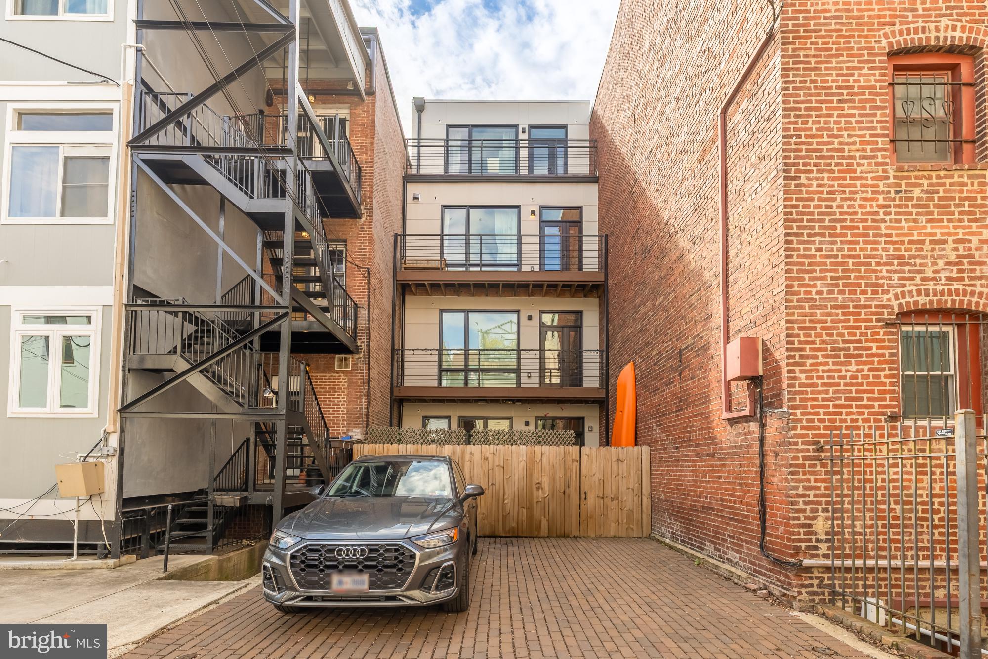 1729 T Street Northwest, Unit 4 Washington, DC 20009 - Photo 2 of 2 a car parked on the side of a building