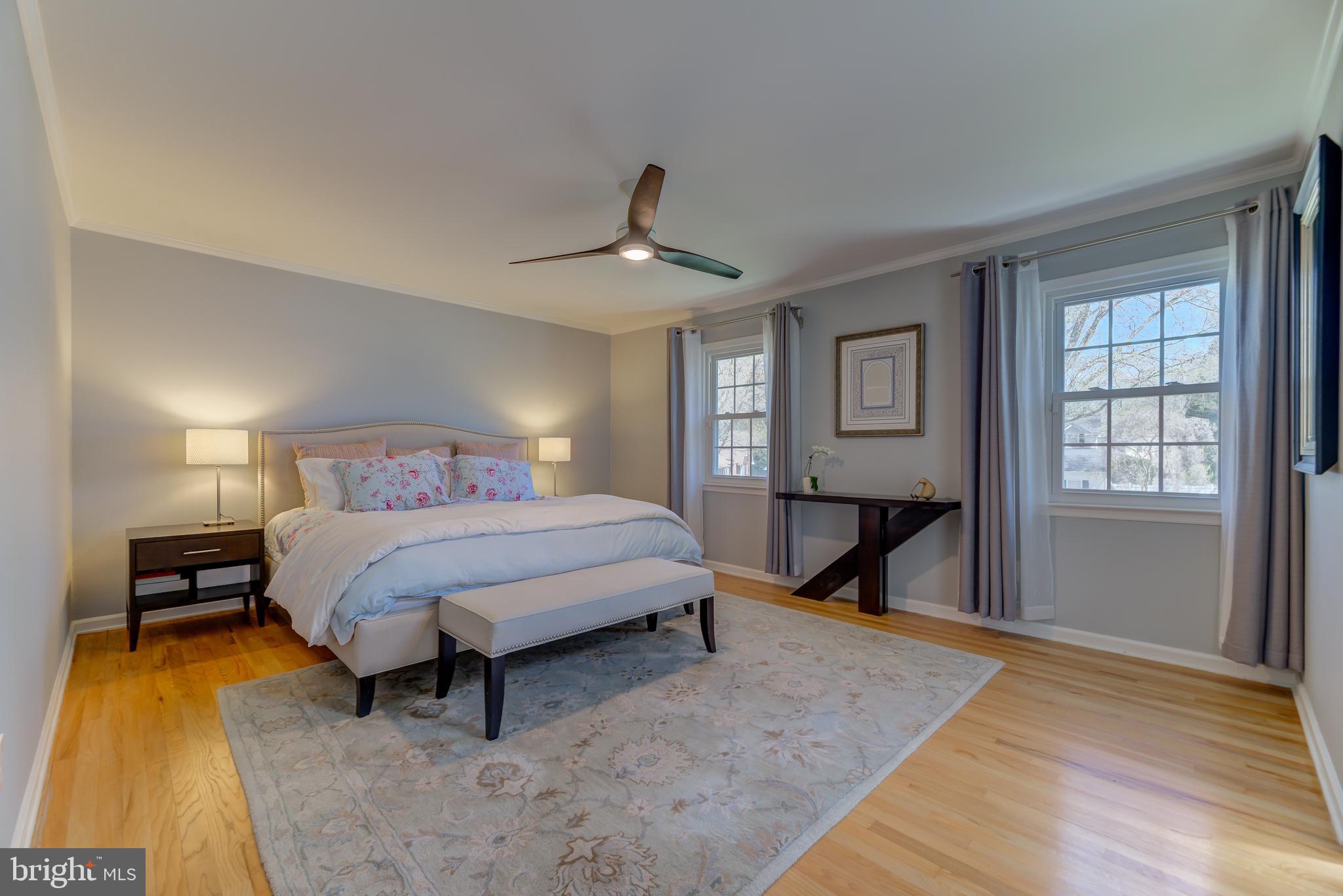 4 Hawk Drive Princeton Junction, NJ 08550 - Photo 26 of 45 a bedroom with a bed a table and painting on the wall