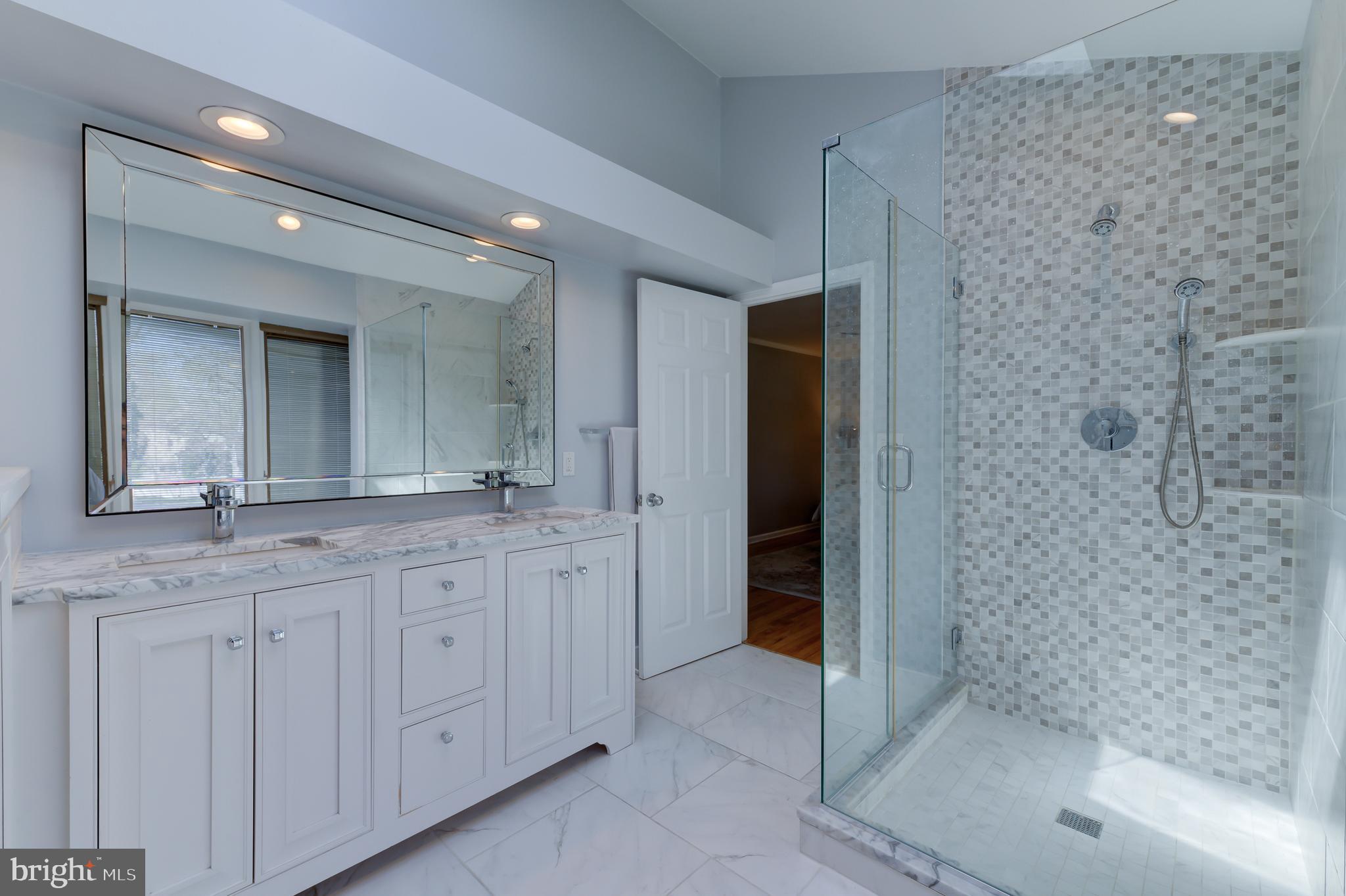 4 Hawk Drive Princeton Junction, NJ 08550 - Photo 28 of 45 a spacious bathroom with a shower a sink and a mirror