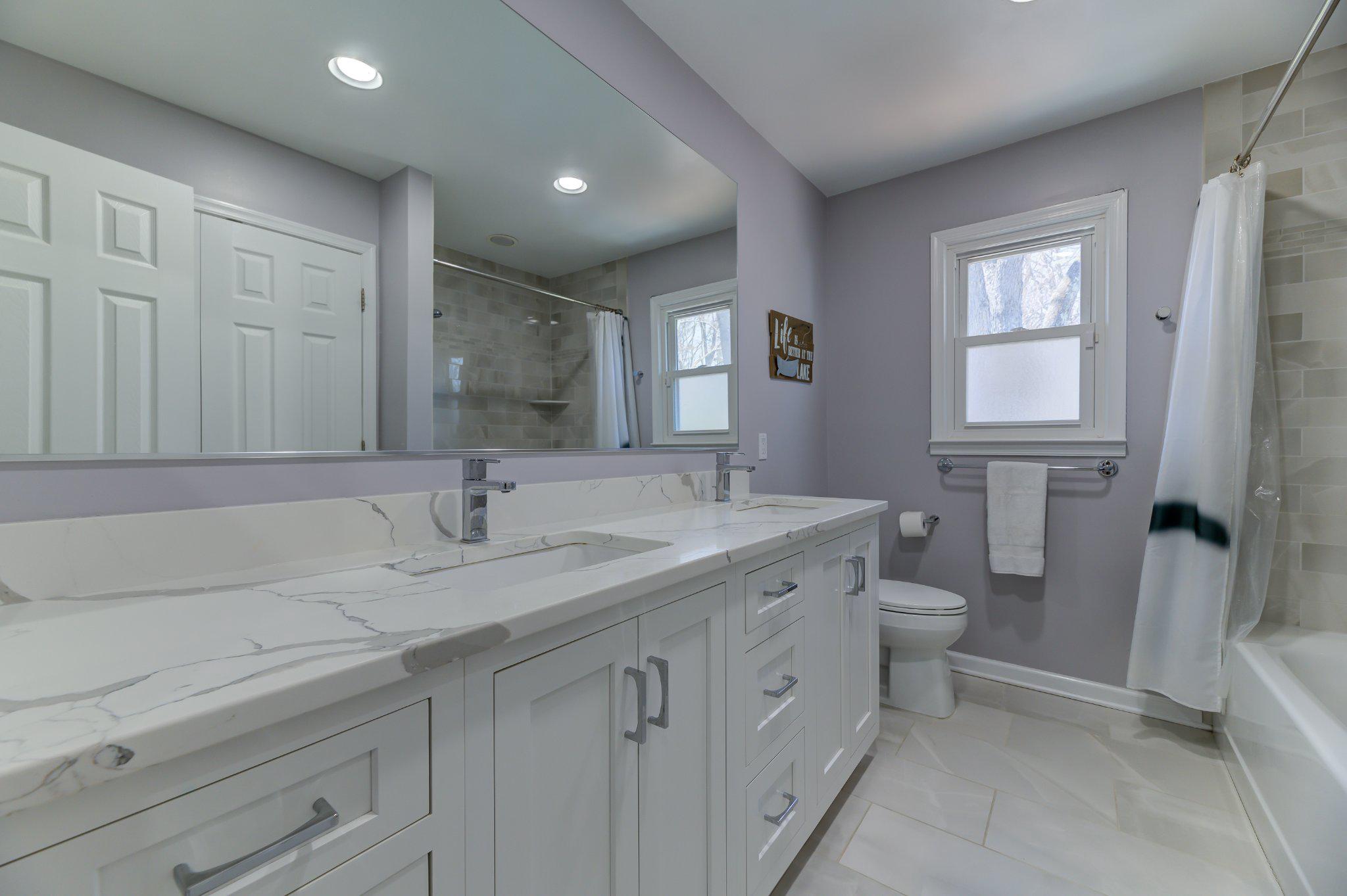 4 Hawk Drive Princeton Junction, NJ 08550 - Photo 33 of 45 a bathroom with a granite countertop sink a toilet and a mirror