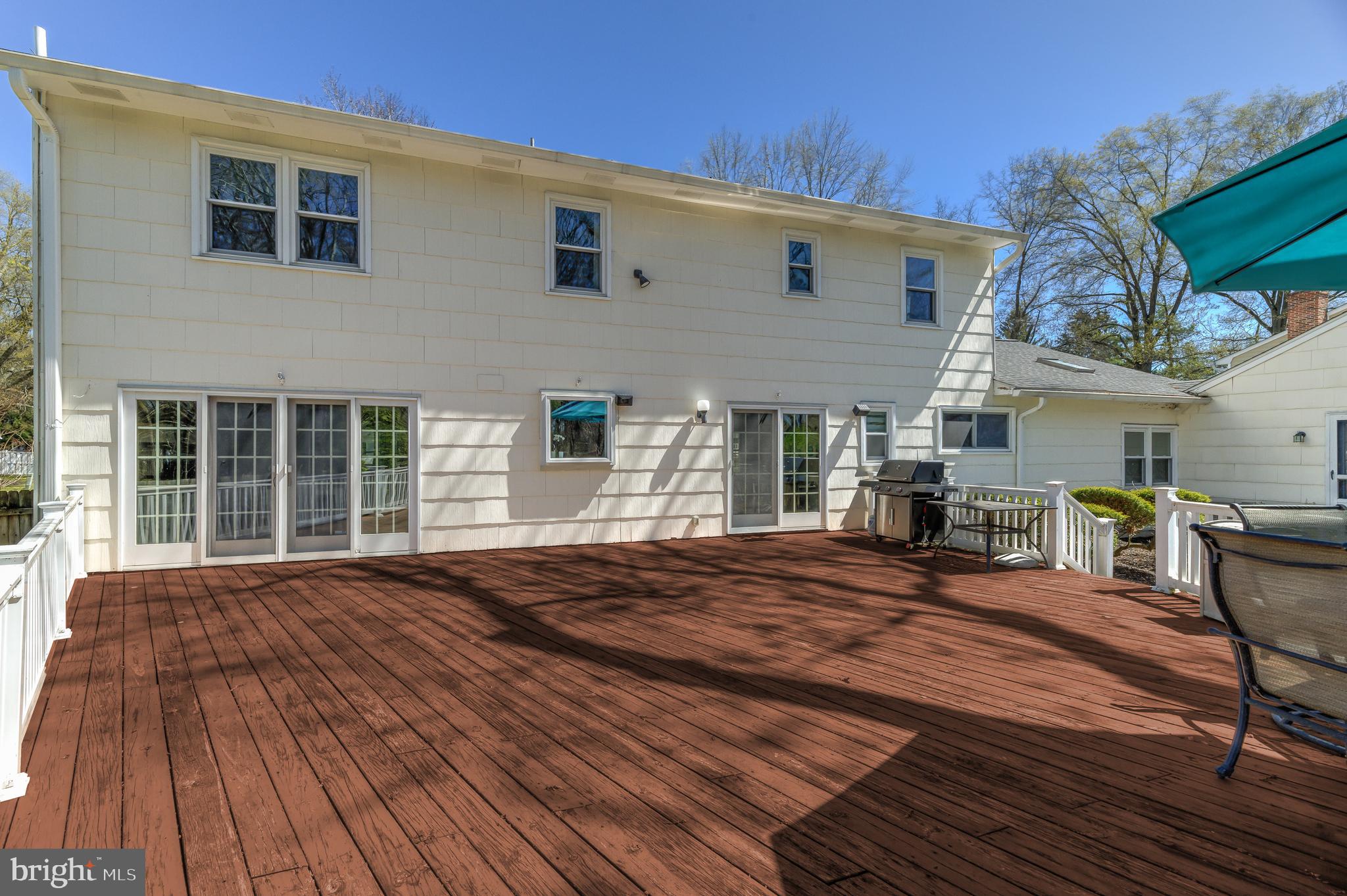4 Hawk Drive Princeton Junction, NJ 08550 - Photo 38 of 45 a front view of house with deck outdoor seating and yard