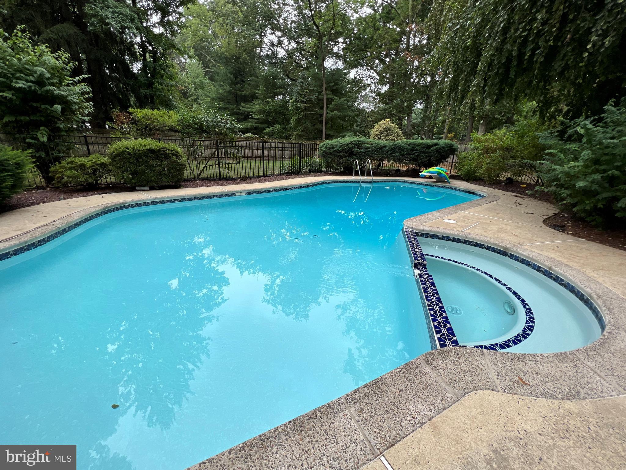 4 Hawk Drive Princeton Junction, NJ 08550 - Photo 40 of 45 a view of a swimming pool and lounge chairs