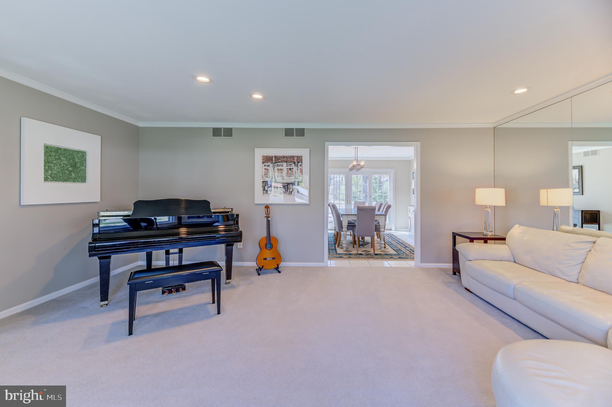 4 Hawk Drive Princeton Junction, NJ 08550 - Photo 8 of 45 a living room with furniture a piano and a wooden floor