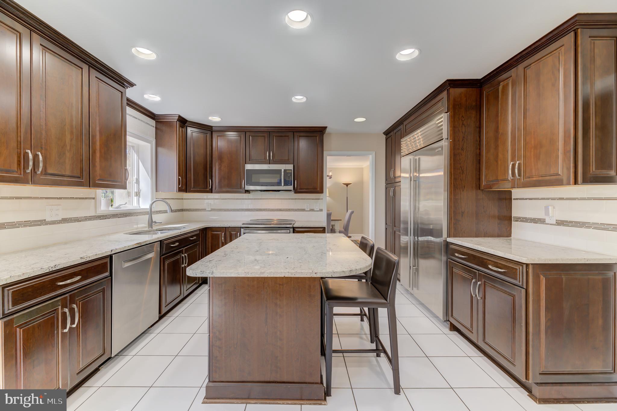 4 Hawk Drive Princeton Junction, NJ 08550 - Photo 9 of 45 a kitchen with stainless steel appliances granite countertop a sink stove and cabinets