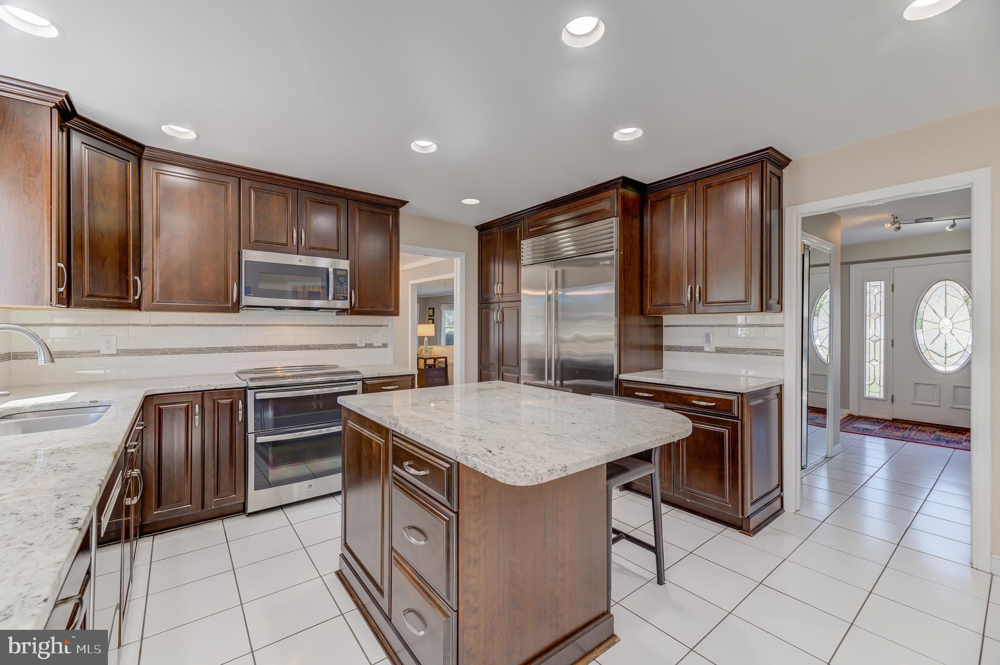 4 Hawk Drive Princeton Junction, NJ 08550 - Photo 10 of 45 a kitchen with a stove sink and cabinets