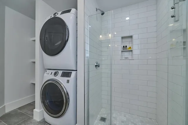 a view of a hallway with washer and dryer