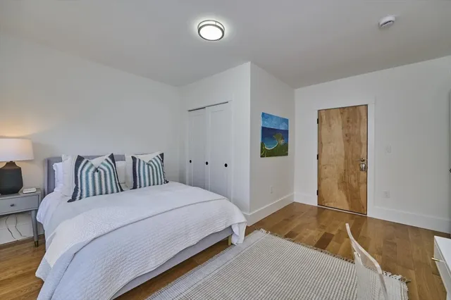 a bedroom with a bed and walk in closet