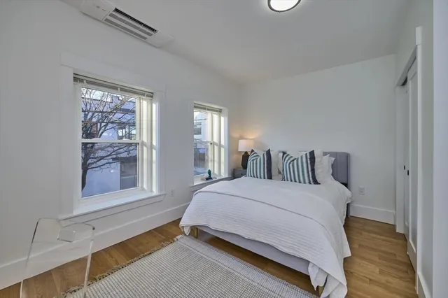 a bedroom with a bed and window
