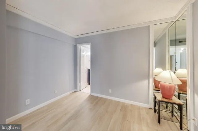 a hallway with table and chairs