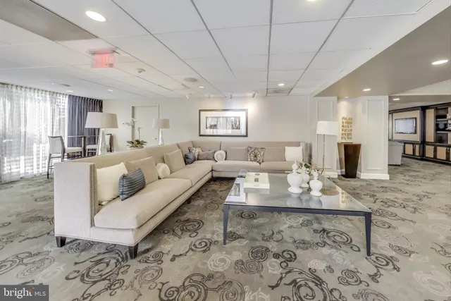 a living room with furniture and a table