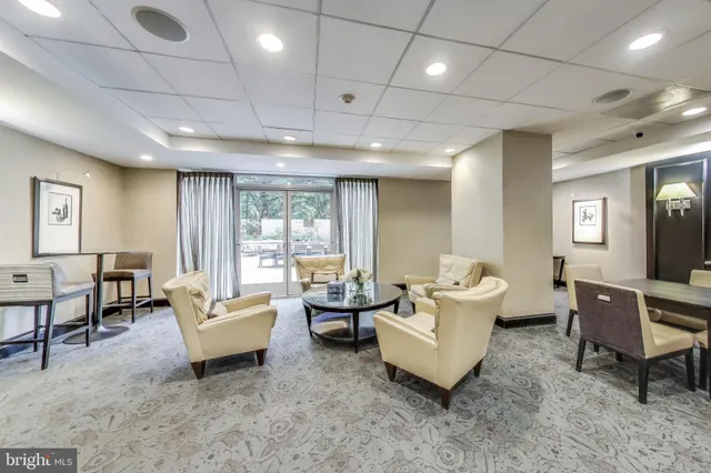 a living room with furniture and a table