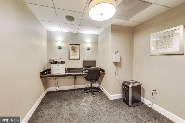 a view of a building with sitting area