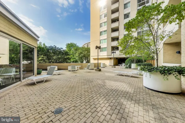 a view of a patio with a chairs and table in a patio