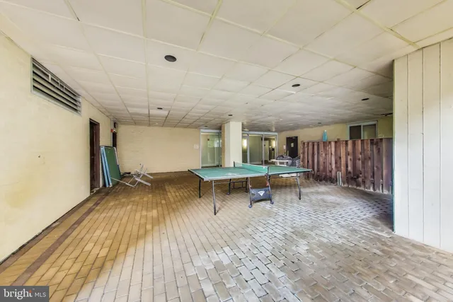 a large building with a bench in front of it