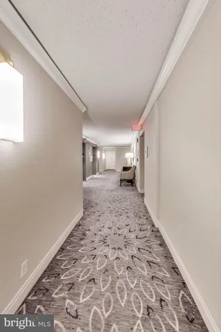 a view of a hallway with closet area