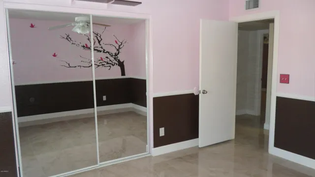 wooden floor in a hall with a window