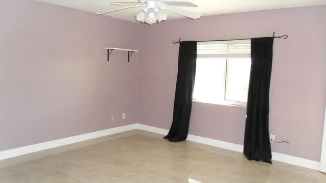 a bathroom with a shower and a toilet