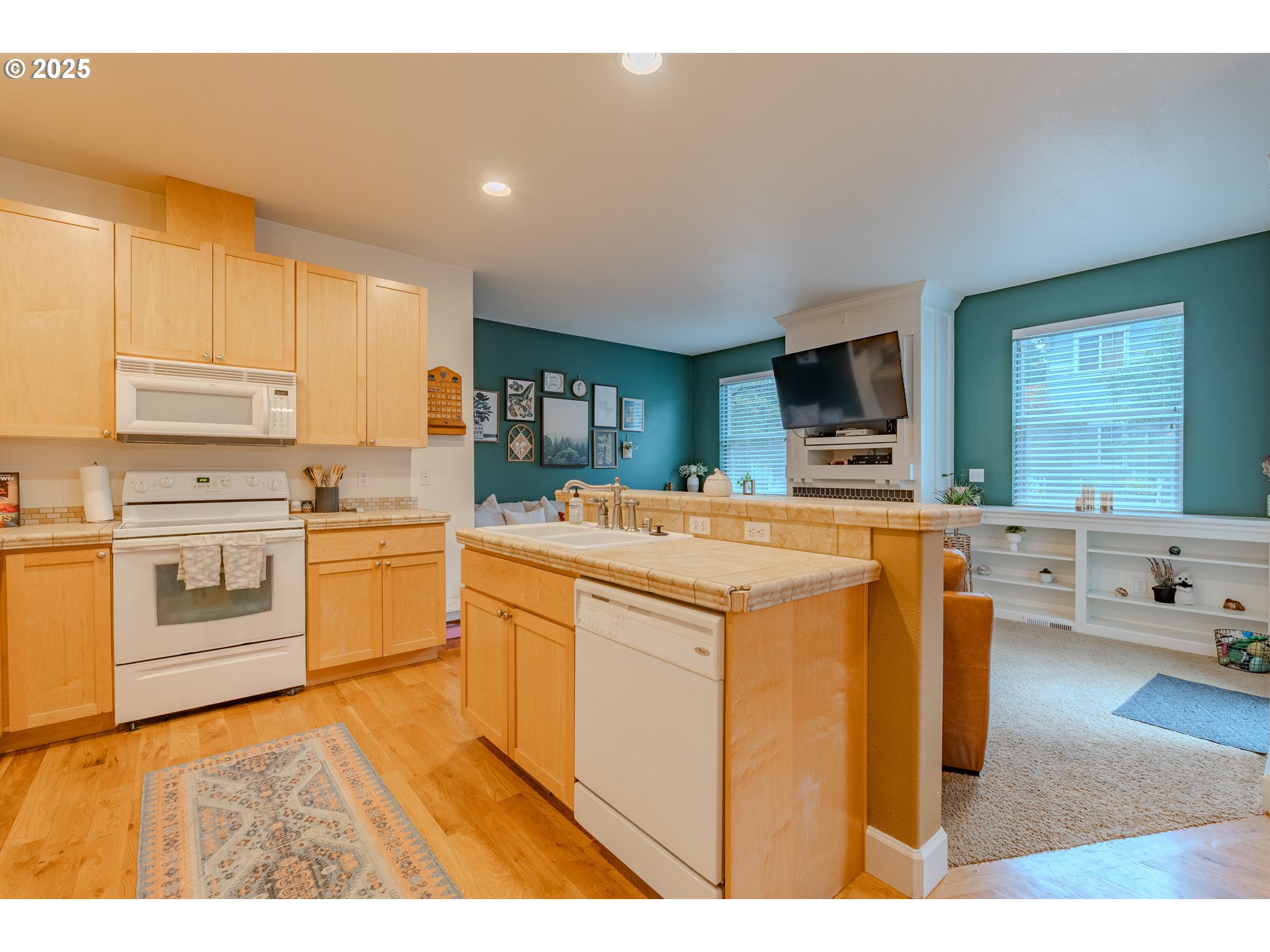 3505 Southeast 197th Avenue Camas, WA 98607 - Photo 11 of 30 a kitchen with stainless steel appliances a stove a sink cabinets and a refrigerator