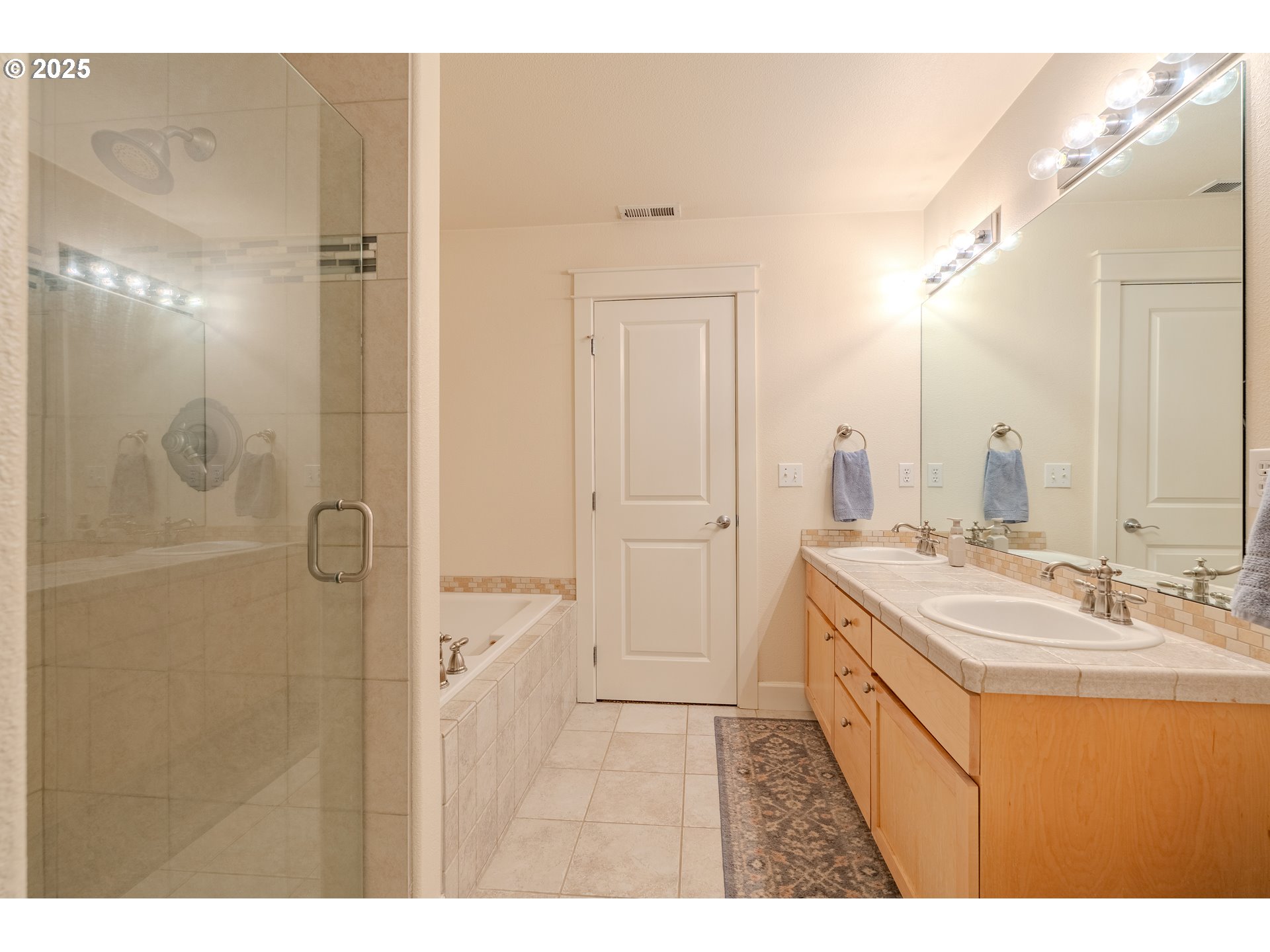 3505 Southeast 197th Avenue Camas, WA 98607 - Photo 21 of 30 a bathroom with a sink a mirror and a shower