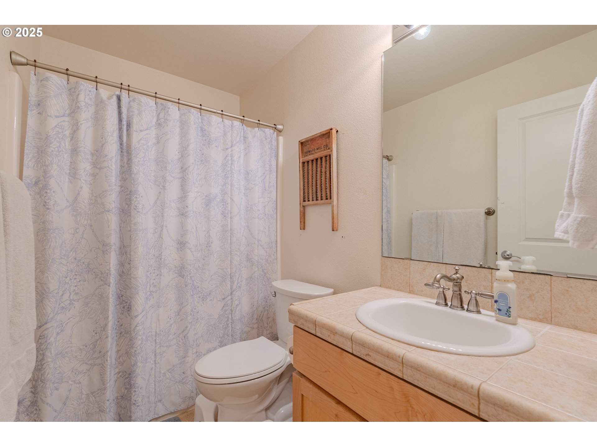 3505 Southeast 197th Avenue Camas, WA 98607 - Photo 29 of 30 a bathroom with a sink toilet and a mirror