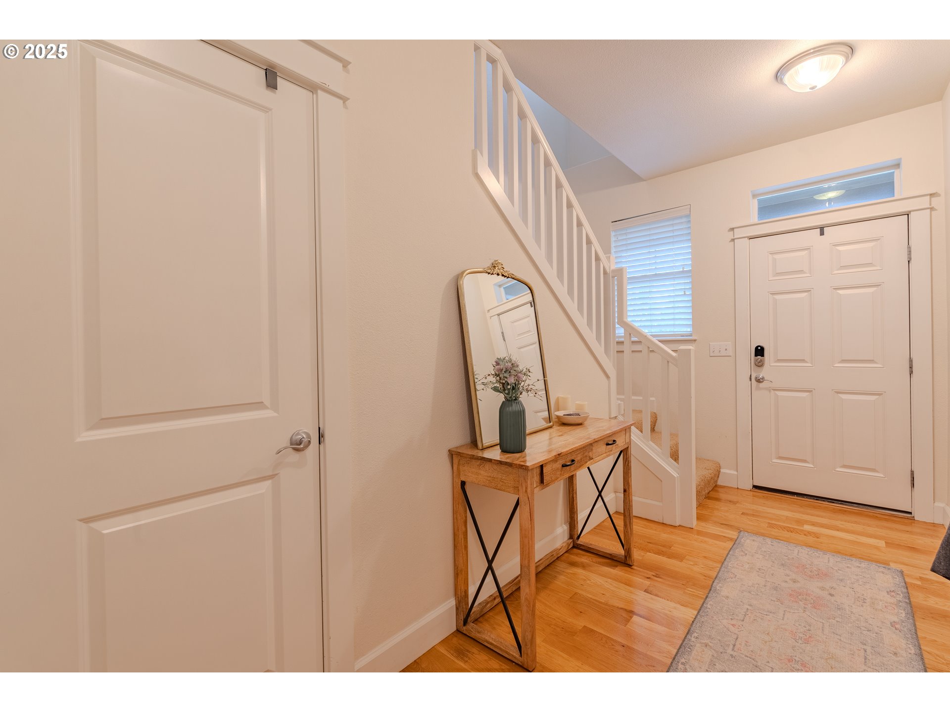 3505 Southeast 197th Avenue Camas, WA 98607 - Photo 6 of 30 a view of a hallway with wooden floor and staircase