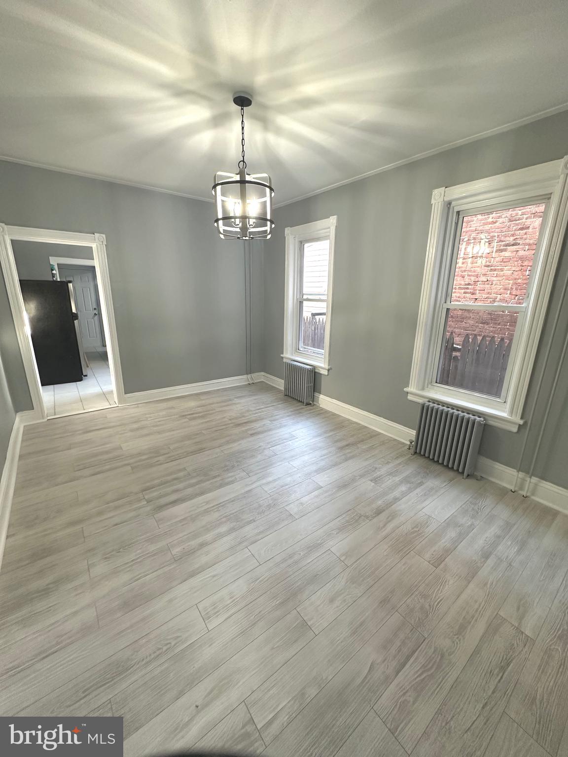 331 Tyler Street Trenton, NJ 08609 - Photo 14 of 49 a view of empty room with wooden floor