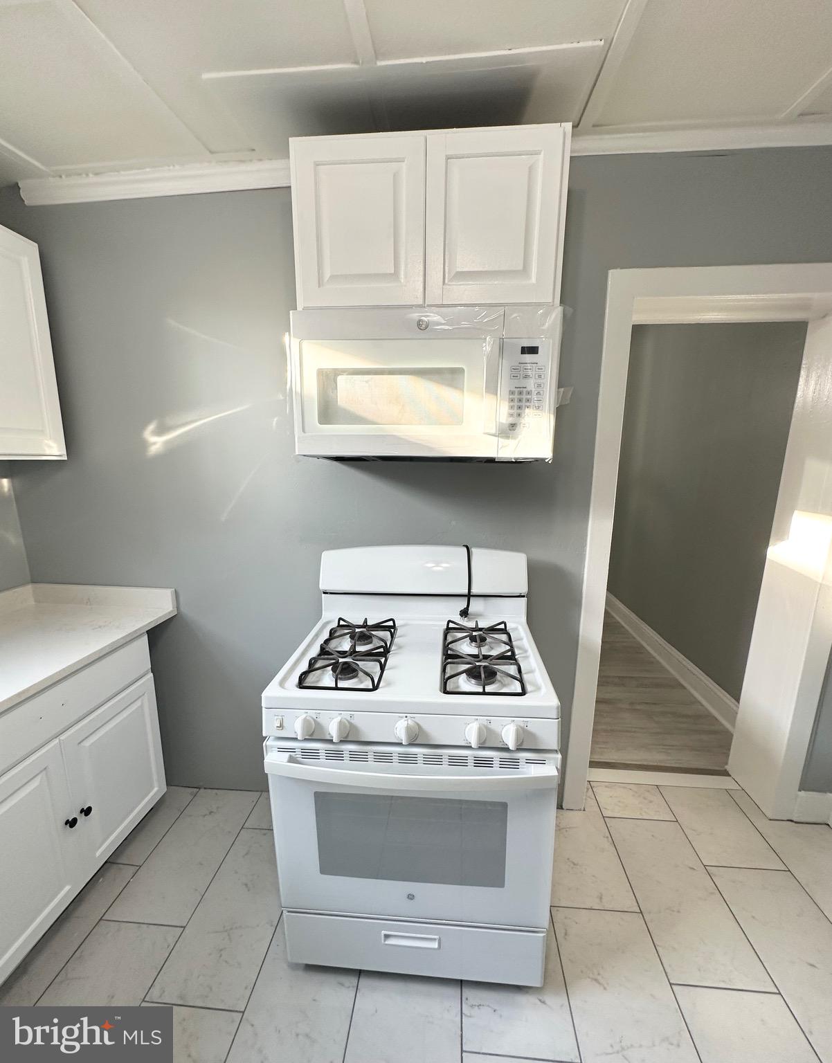 331 Tyler Street Trenton, NJ 08609 - Photo 18 of 49 a stove top oven sitting inside of a kitchen