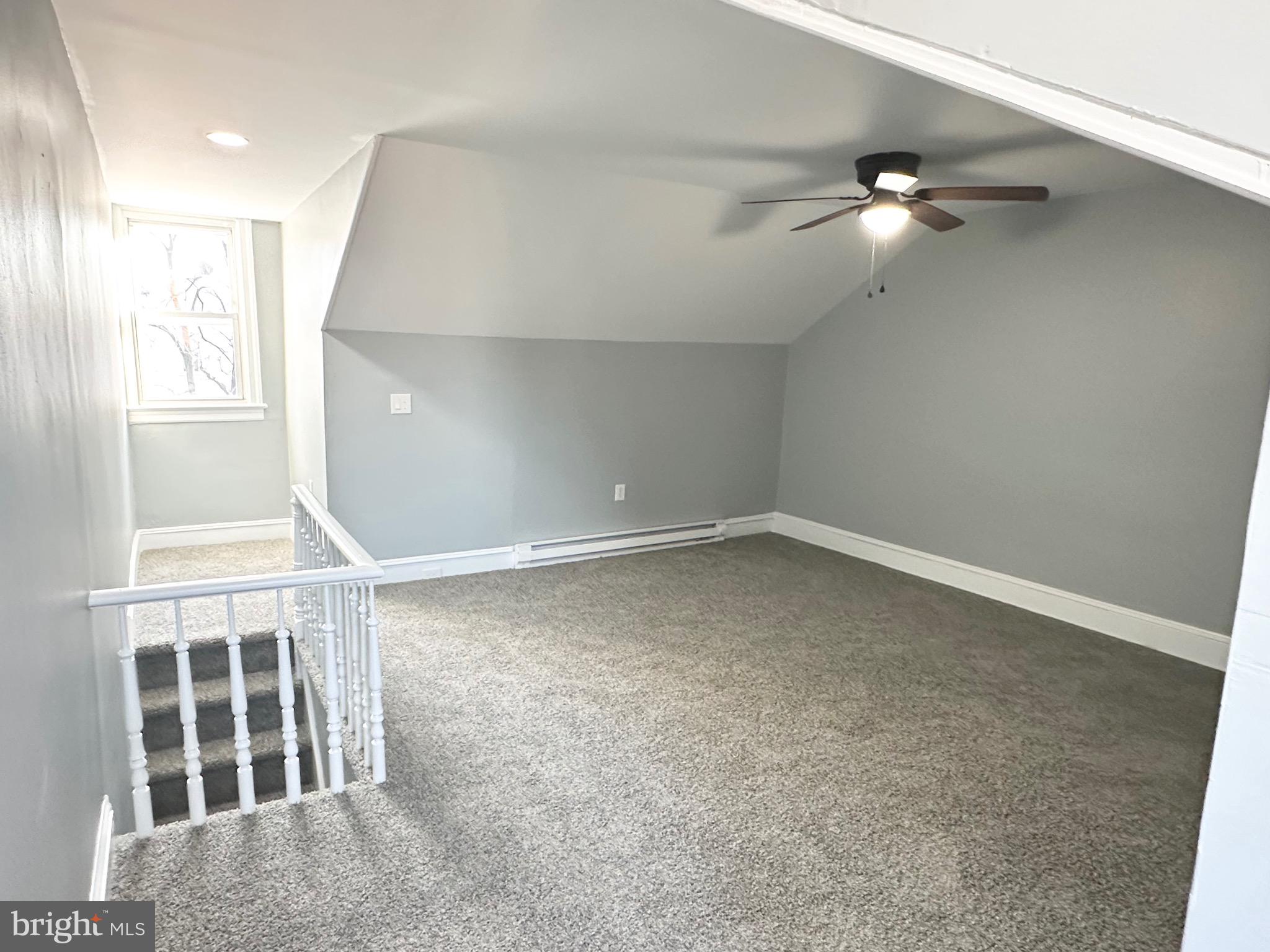 331 Tyler Street Trenton, NJ 08609 - Photo 35 of 49 an empty room with windows and fan